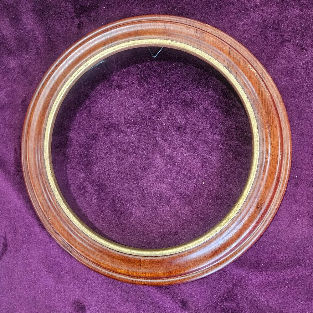 Van Hygan & Smythe plate frame with gold trim.